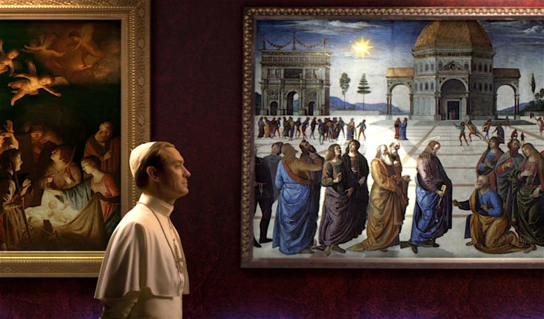 A still from The Young Pope's opening cinematic, showing Jude Law walking past some old religious paintings